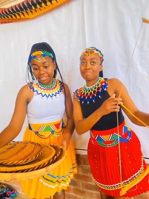 Students at Education Matters school in Zimbabwe showcase traditional Ndebele culture attire proudly together.