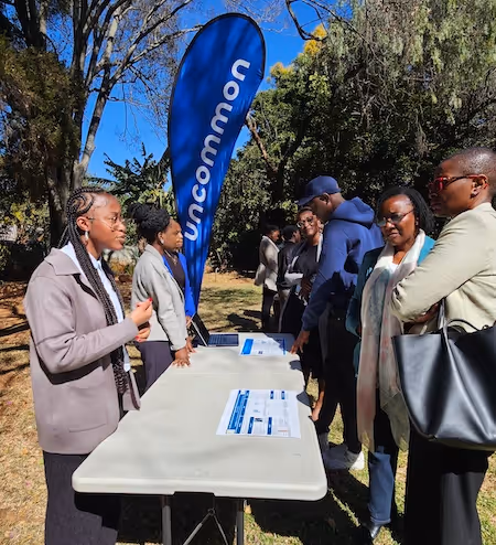 Students and community gather at Education Matters school in Zimbabwe, Africa outdoors.