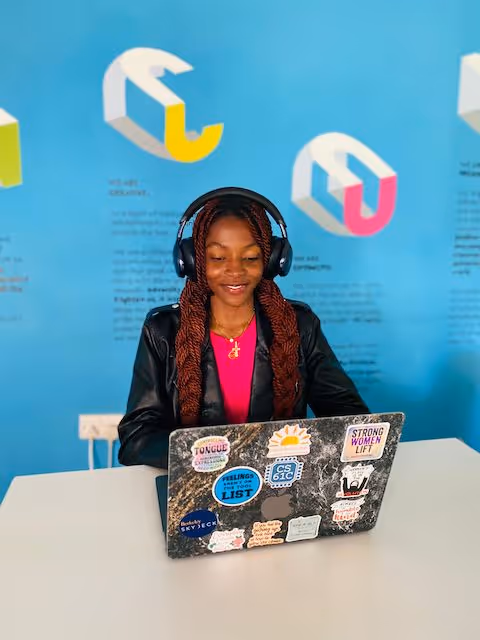 African student using laptop at Education Matters school in Zimbabwe learning environment.
