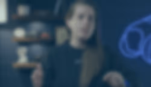 Blurry figure in dark room with soft blue light and shadowy objects