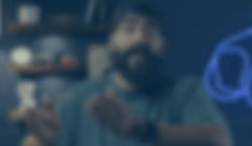 Blurry image of people in dark setting with blue tones