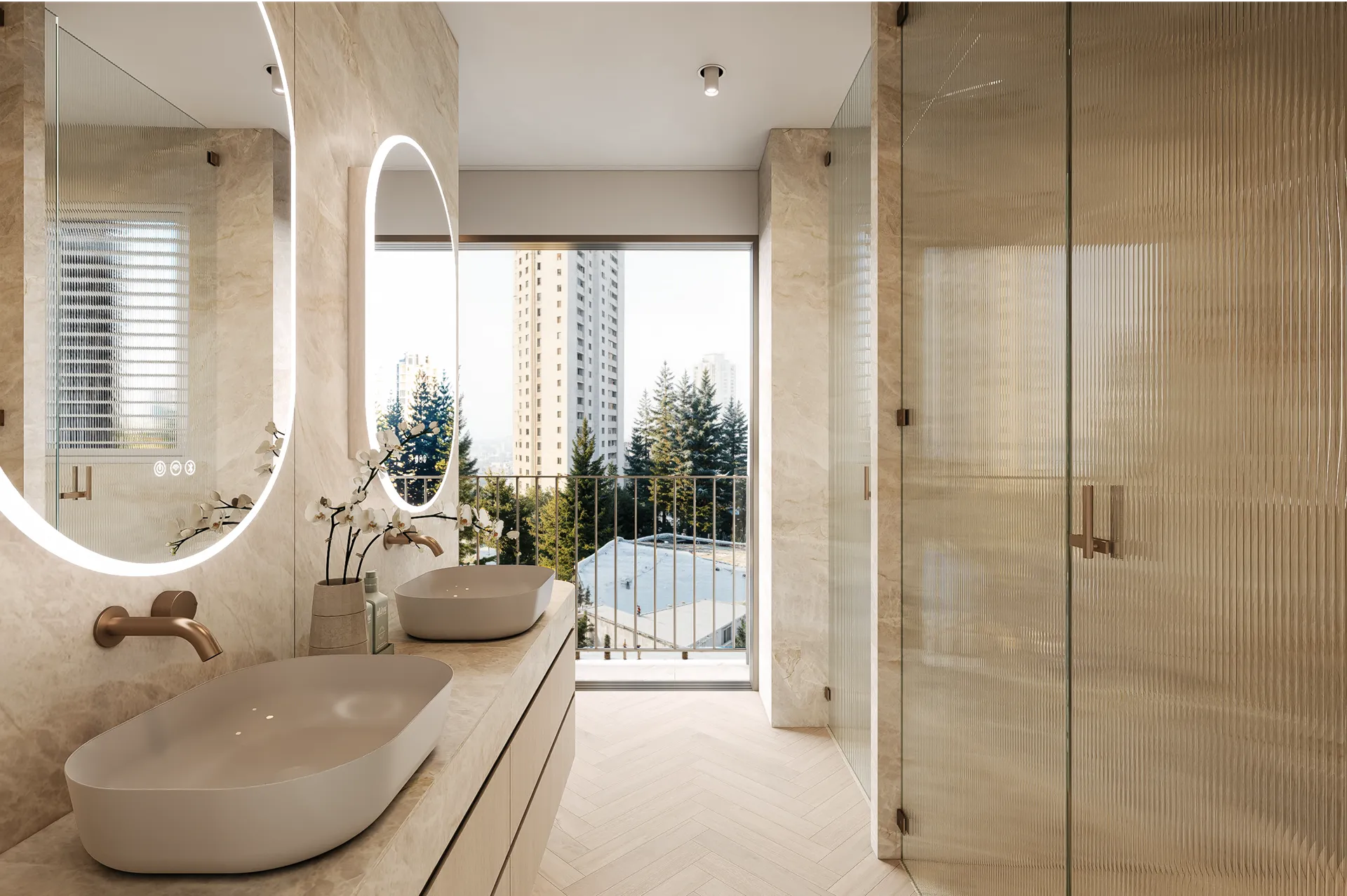 Modern bathroom with double oval sinks, backlit oval mirrors, beige marble walls, glass shower, and a large window overlooking trees and buildings.
