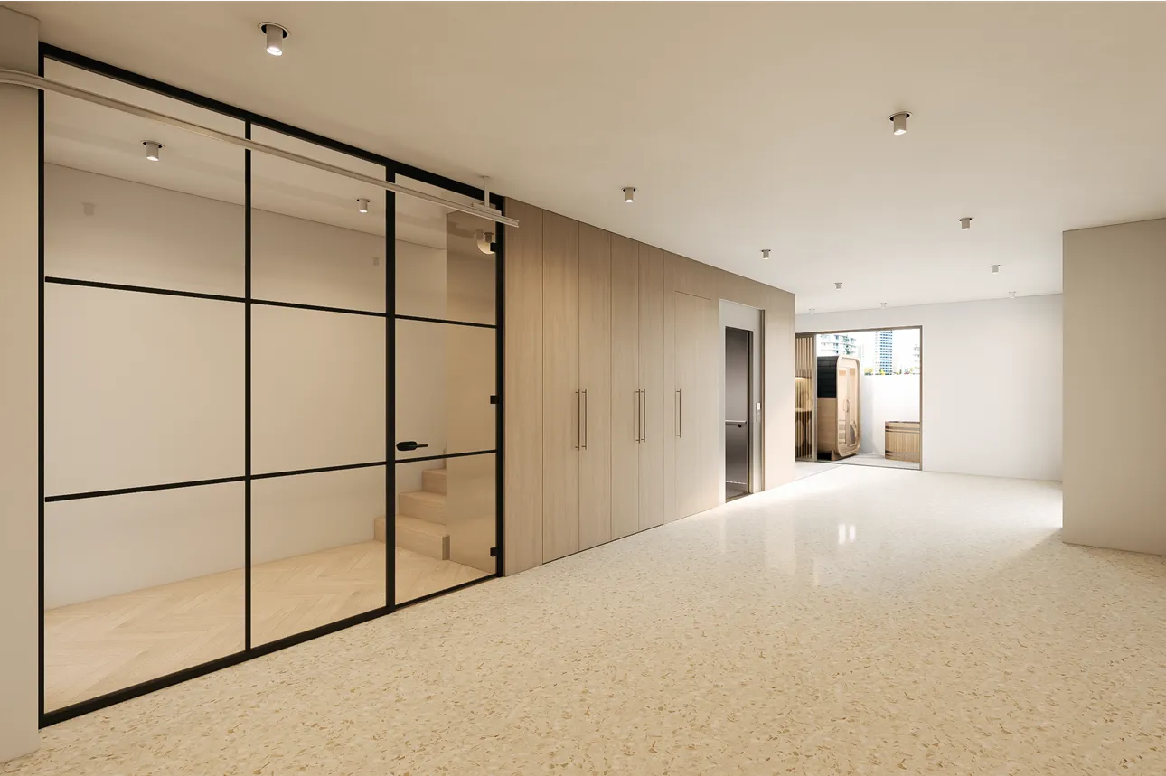 Bright modern interior room with terrazzo floor, wood-paneled wall with tall cabinets, glass sliding door revealing wooden stairs, and an open doorway to an outdoor space.