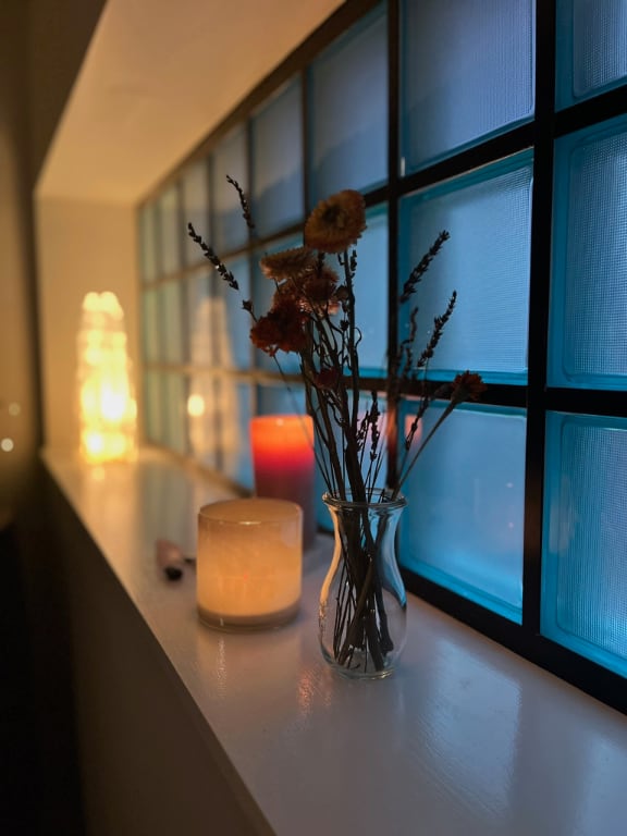 The frosted glass window in our treatment room at Cleveland Embodiment Collective in Tremont