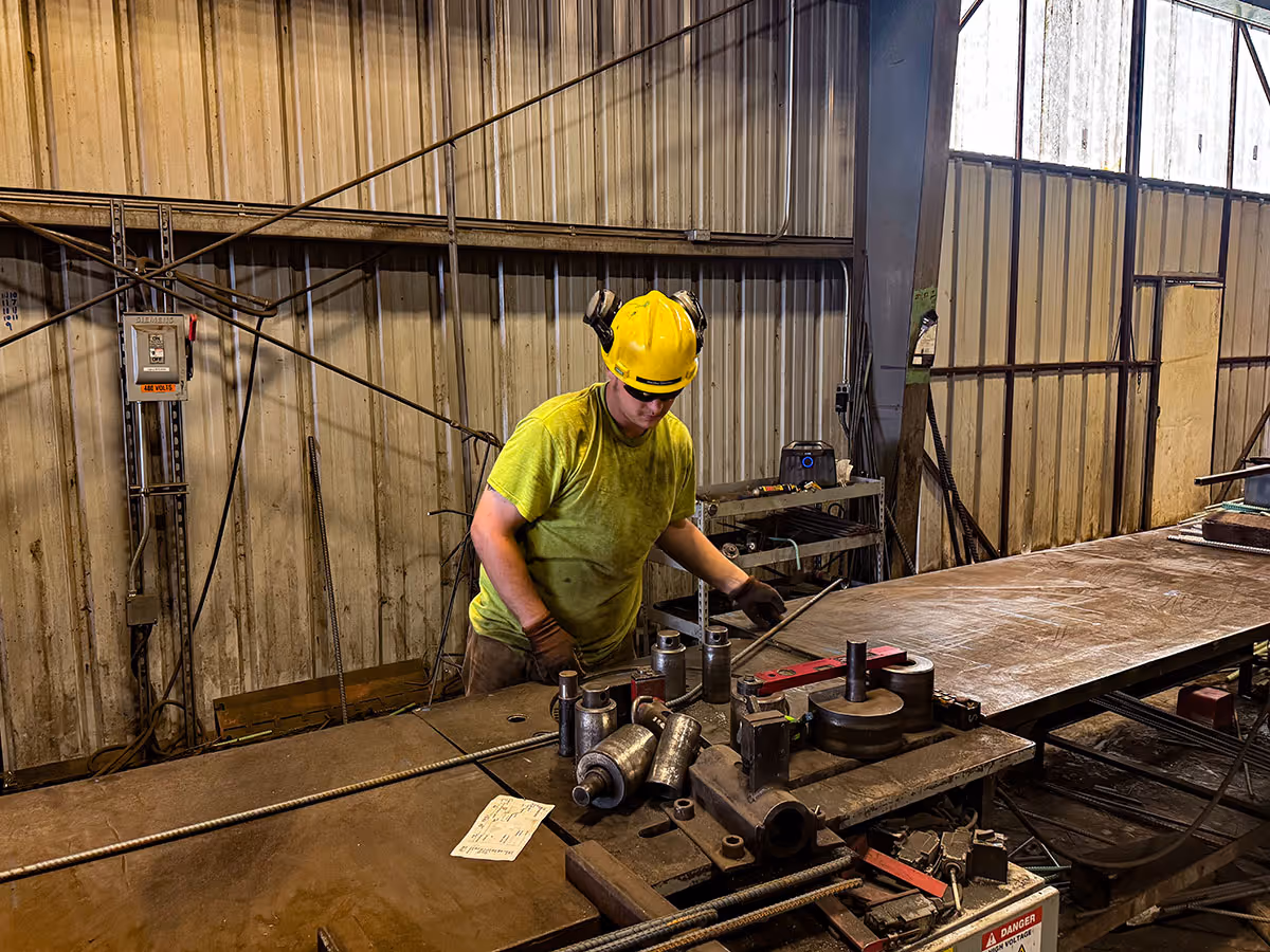 Man fabricating reinforcing bar
