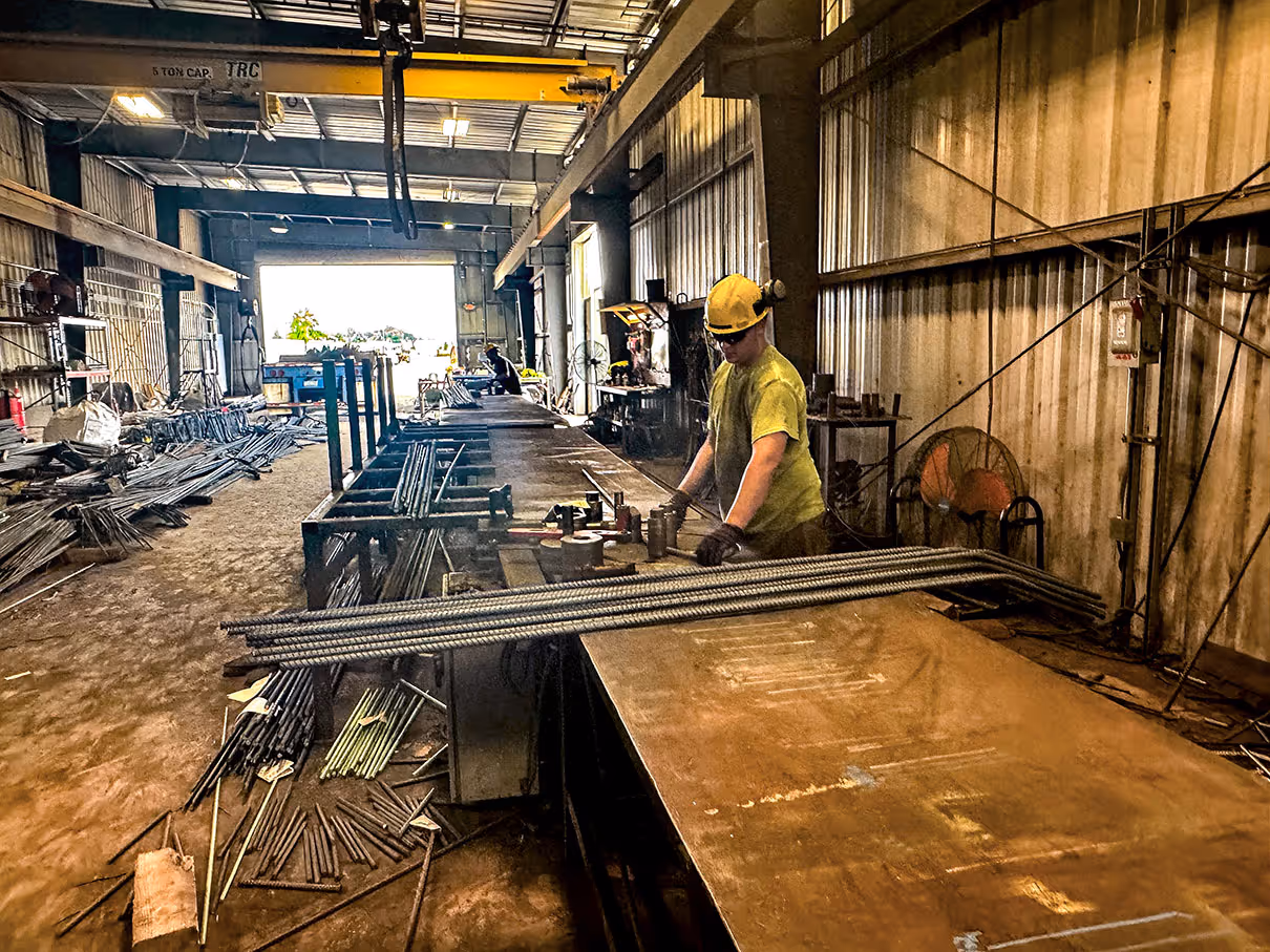 Man fabricating reinforcing bar