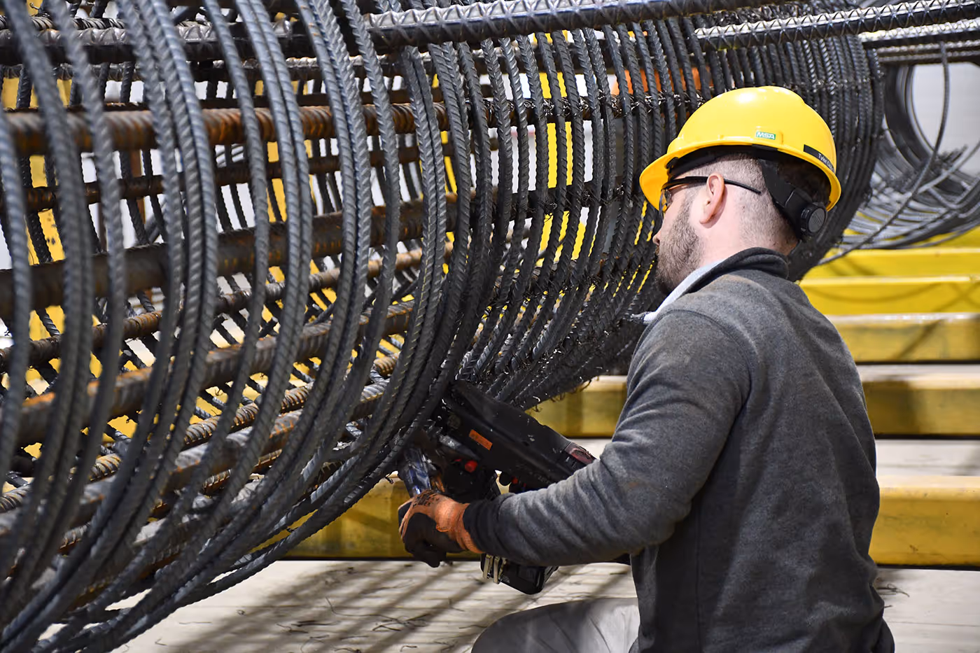 Man working on prebuilt cage