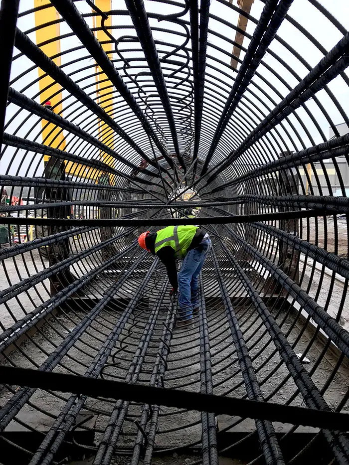 Men working on bridge setting rebar