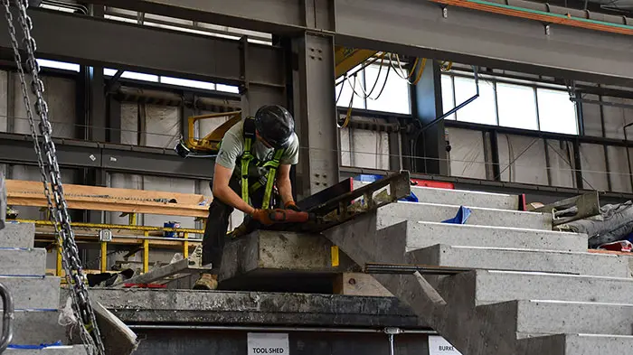 men working in shop on concrete precast