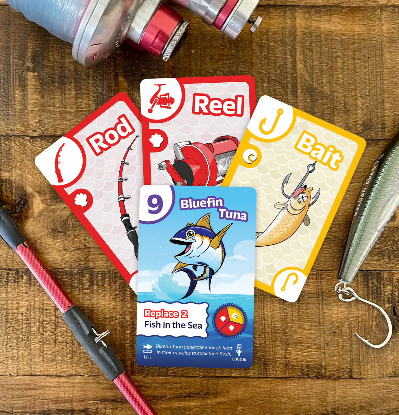 Trophy Fishing card game setup with cards arranged on a table during play test.