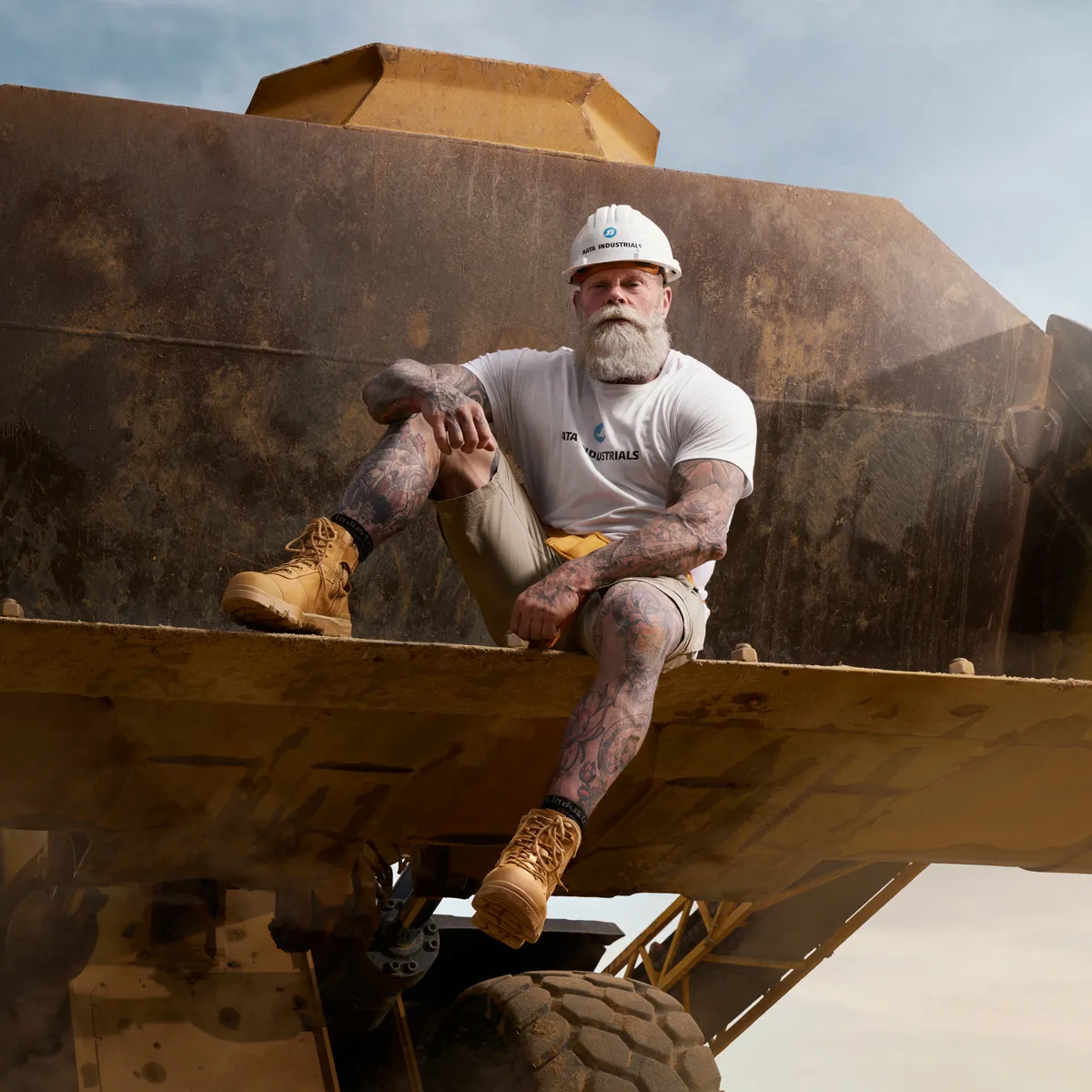 Man sitting on construction vehicle