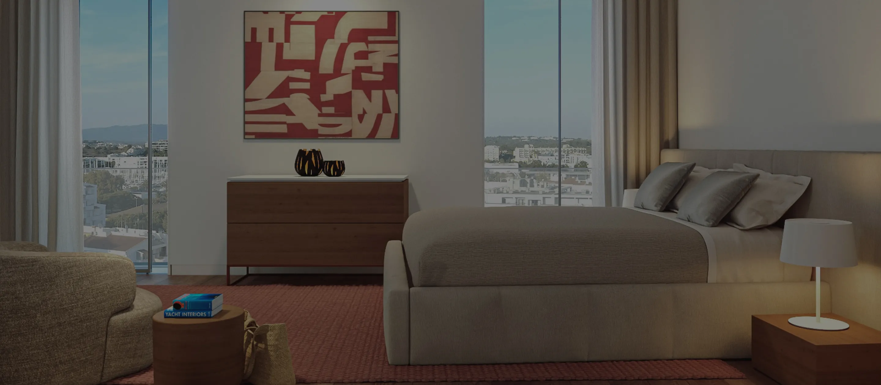 Luxury bedroom with large windows, modern artwork, and city views in Lagos, Portugal.