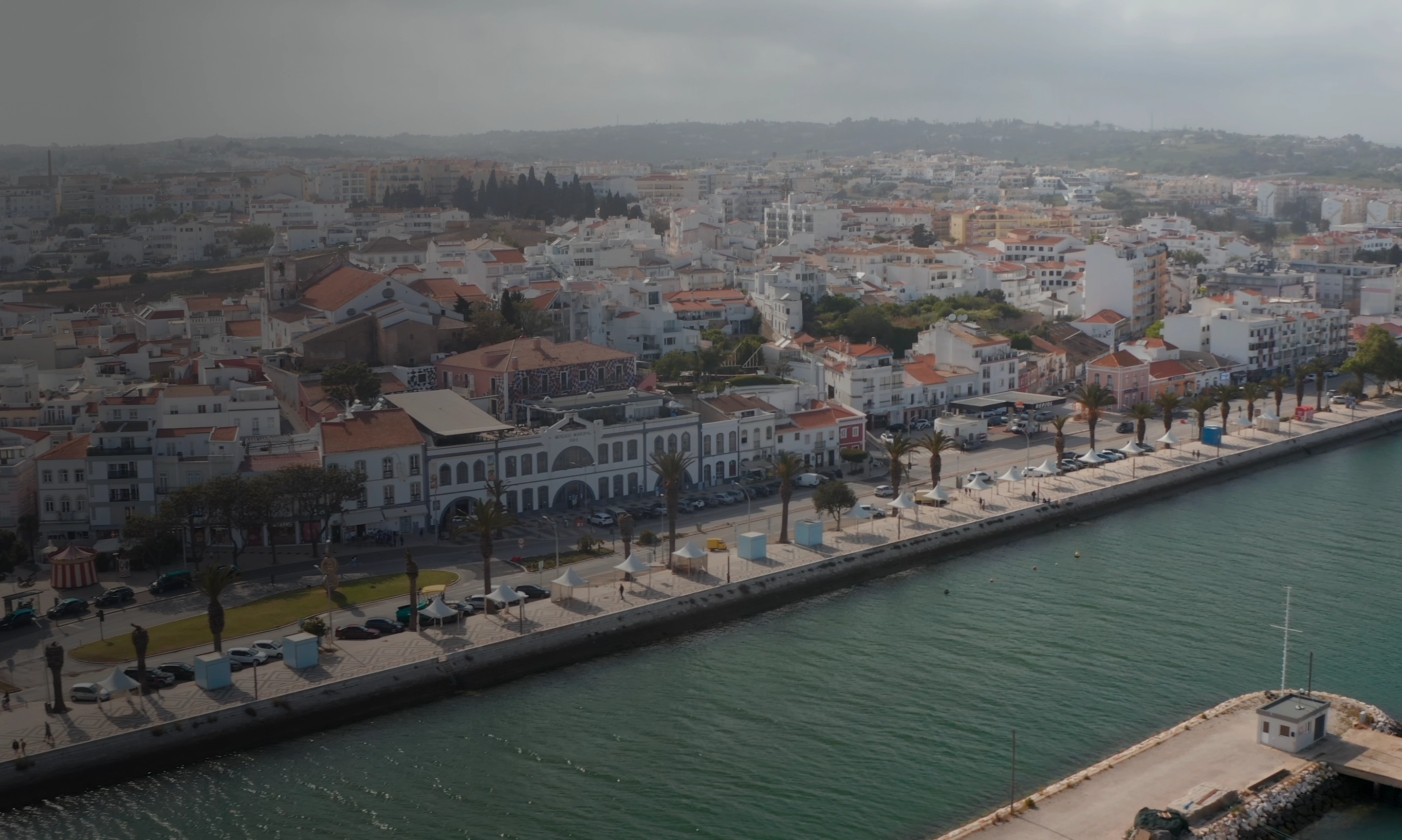 Aerial view of the coastal town of Lagos with traditional Portuguese architecture and marina waterfront.