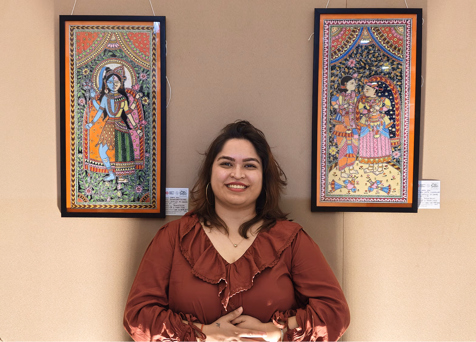 Aadi poses with her artworks displayed at the PAF event.