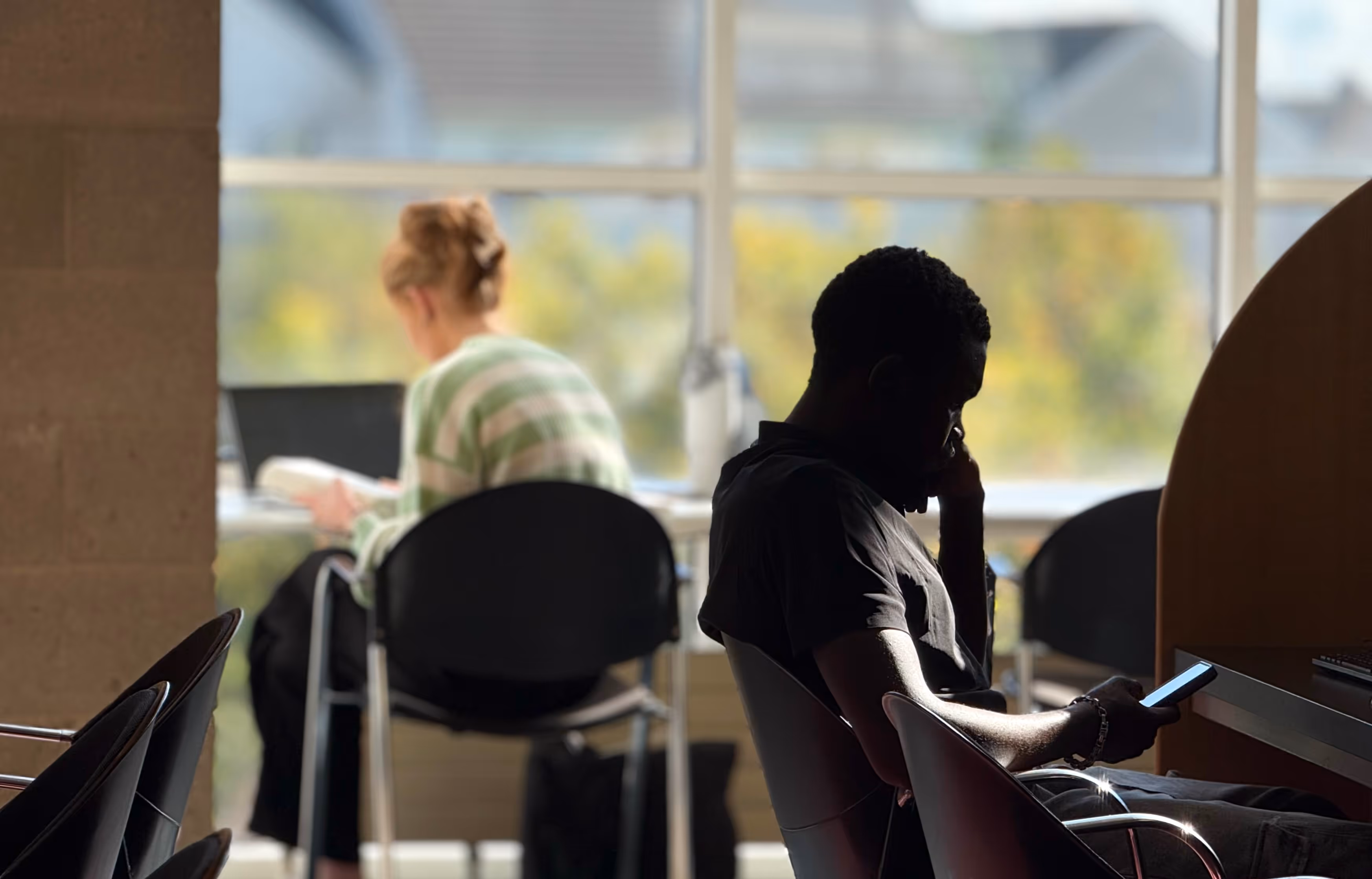 2 students in the library at the Technological University of Shannon, Limerick