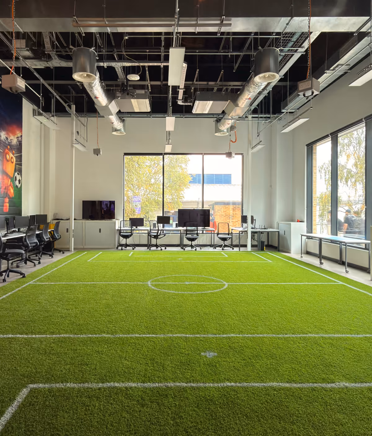 The robotics classroom at the University of Hertfordshire has a setup for practical learning and experiments, which removes the need for separate labs unlike traditional setups.