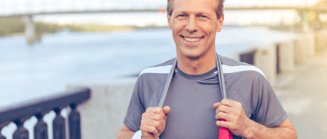 A confident man smiling after regaining energy with testosterone therapy