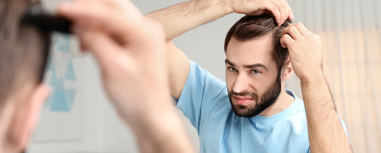 Close-up of PRP hair restoration treatment, showing a medical professional injecting the scalp to stimulate hair regrowth.