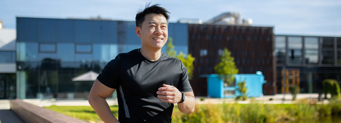 Man jogging through the city, symbolizing renewed energy and vitality from TRT clinic in Old Toronto, ON.