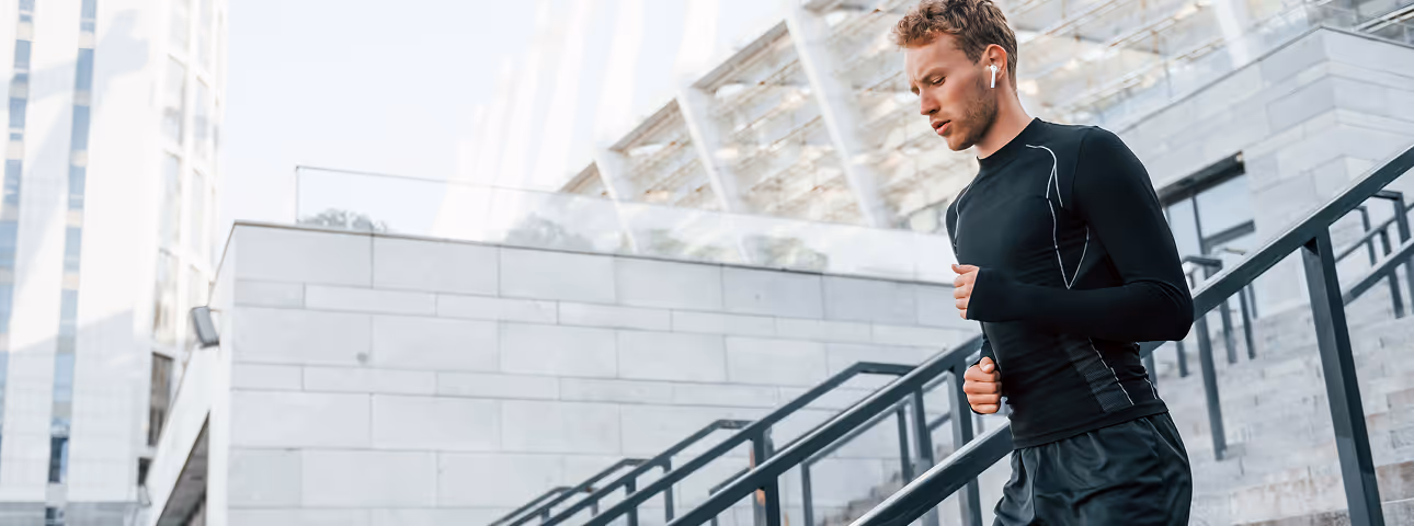 Man jogging outdoors in athletic gear, promoting energy and endurance benefits of Sermorelin peptide therapy