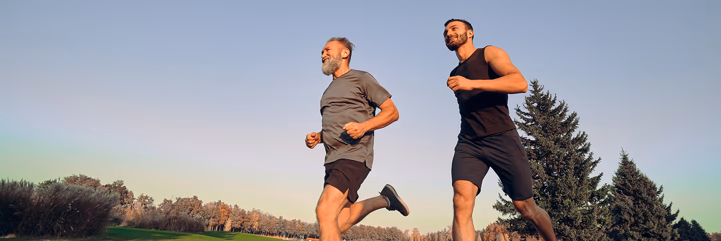 Two men running outdoors, symbolizing increased energy and stamina from Sermorelin peptide therapy