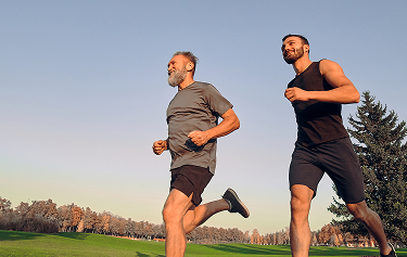 Two men running outdoors, symbolizing increased energy and stamina from Sermorelin peptide therapy