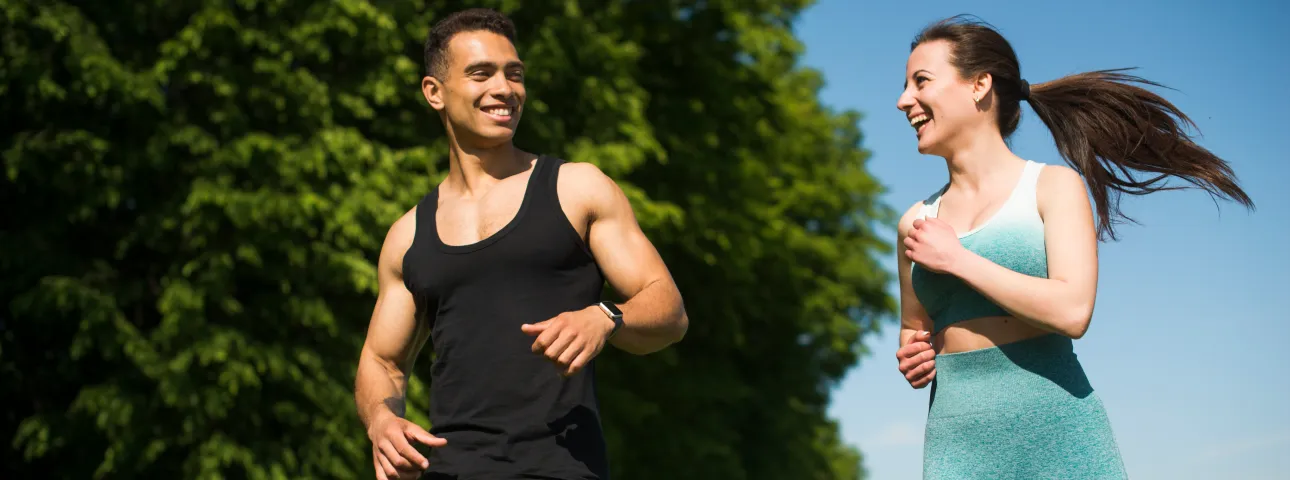 Two people running side by side for weight loss motivation