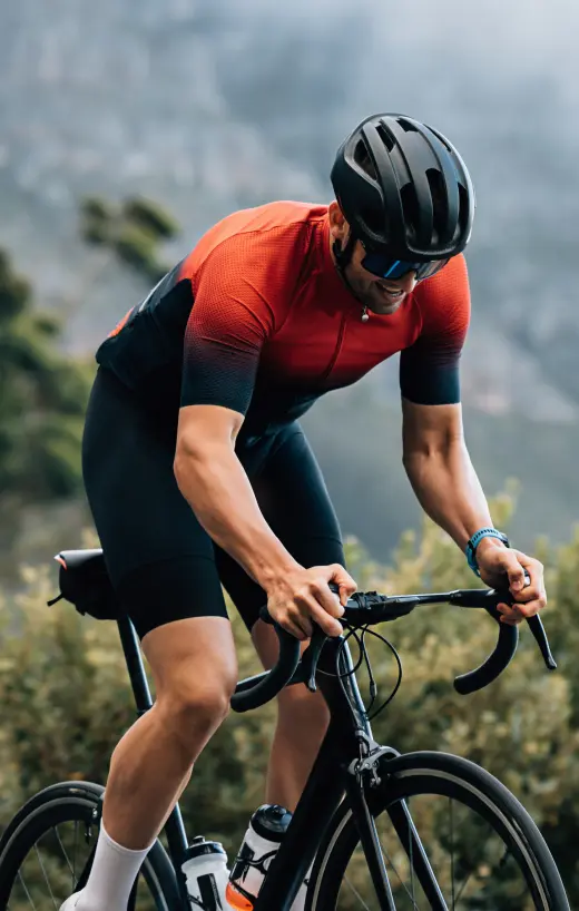 A man cycling with focus and determination, reflecting the strength and endurance supported by testosterone cypionate in TRT