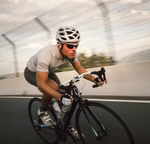 Sporty man biking outdoors, highlighting Clomid’s impact on stamina and strength.