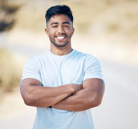 Smiling man with arms crossed, representing success in men's weight loss with phentermine.