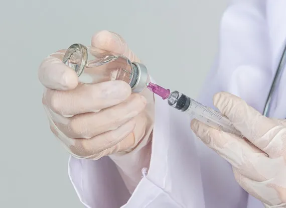 Medical professional preparing Trimix injection for Erectile Dysfunction treatment