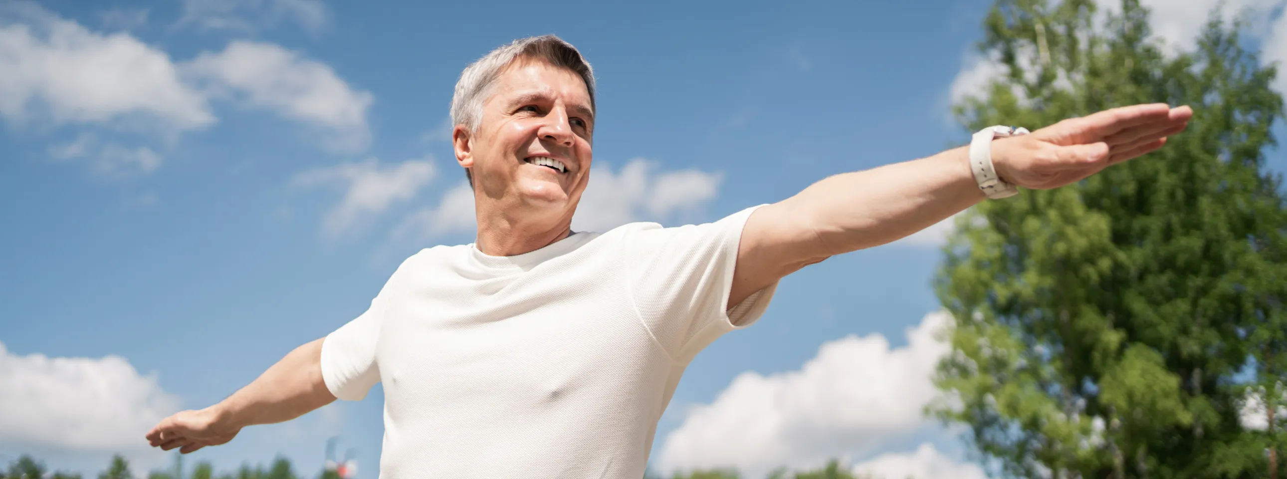 Older man enjoying active lifestyle outdoors, representing vitality and wellness from Sermorelin therapy