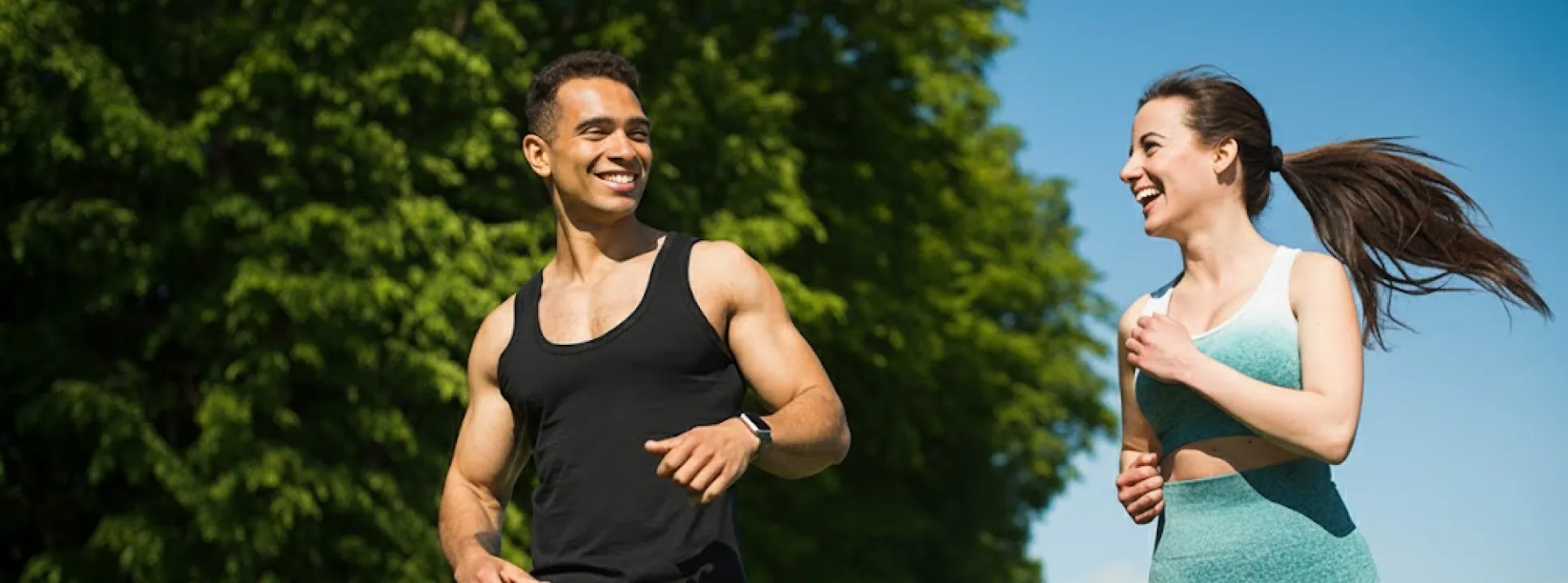 Two people running side by side for weight loss motivation