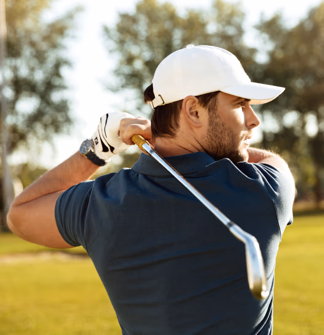 Man playing golf showcasing improved energy and focus from Clomid