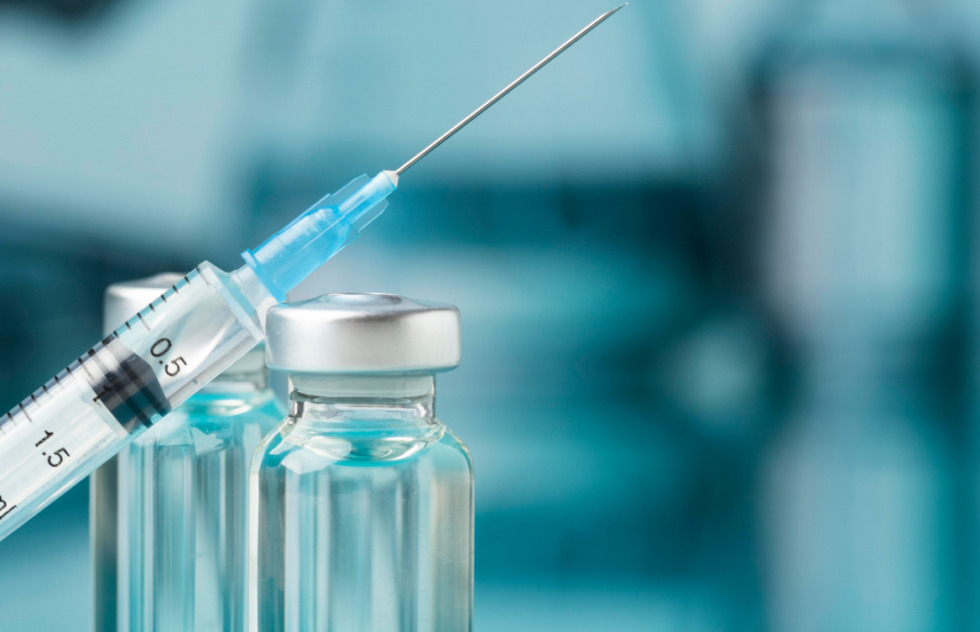 Close-up of a syringe and medical vials representing HGH and Sermorelin therapy for men at Gameday Men’s Health.