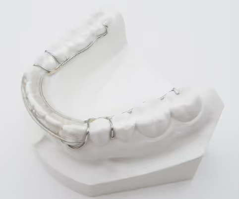 Wire retainer with extension for enhanced orthodontic stability - H32 Dental