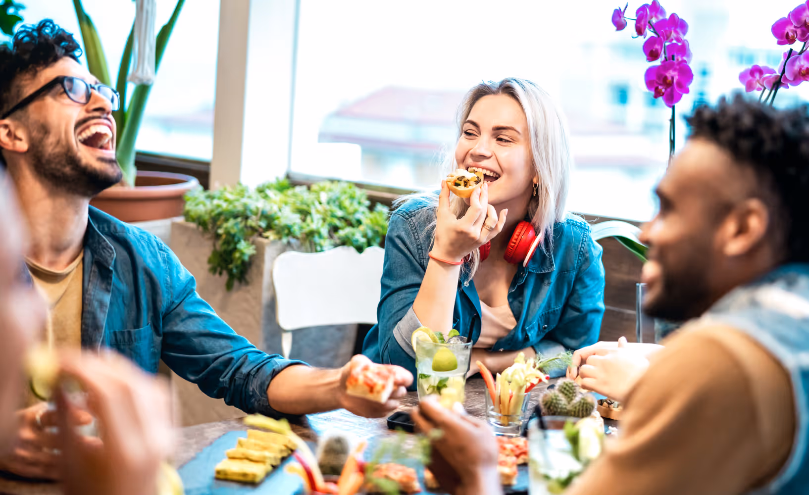 A group of young people enjoying a restaurant