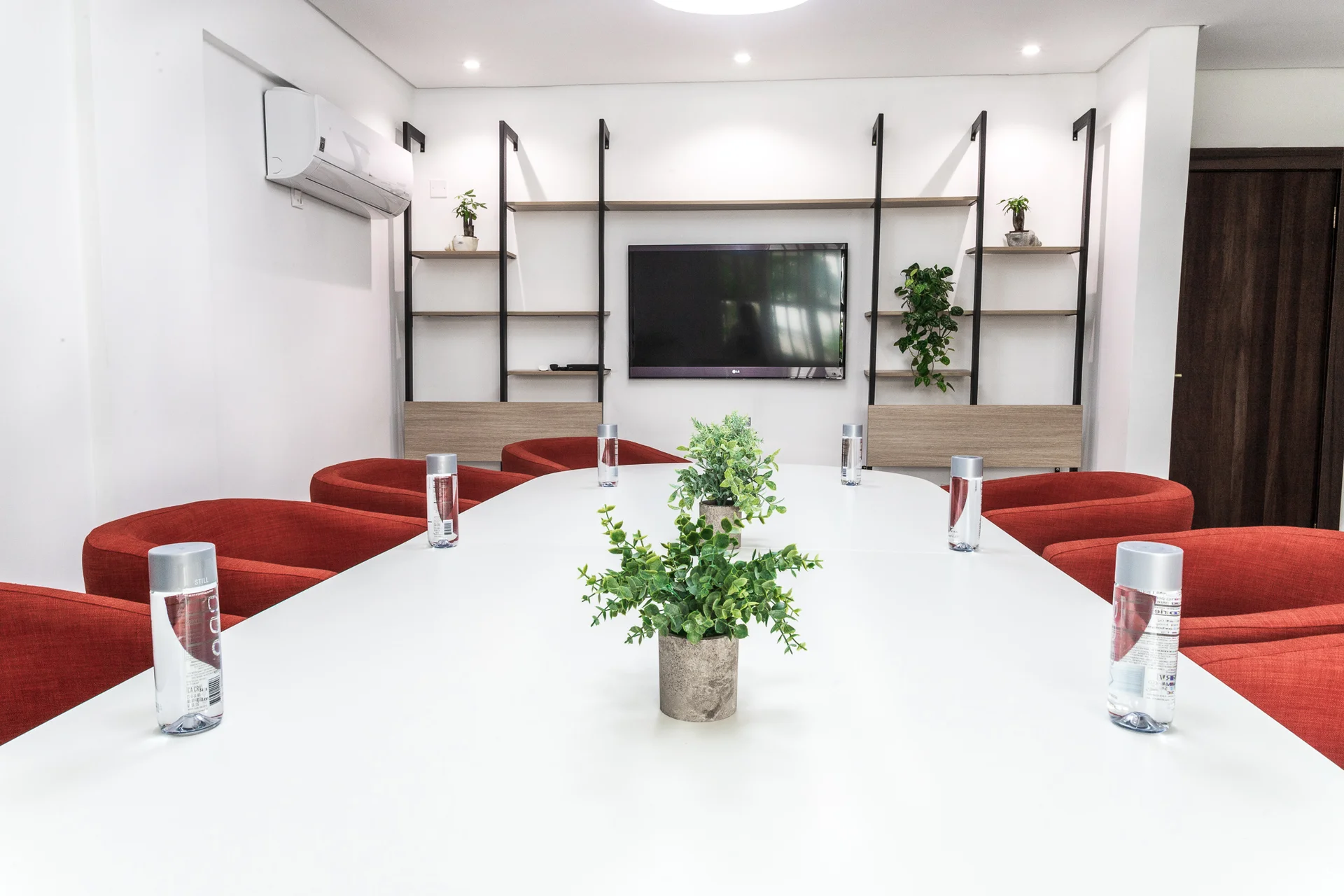 Woman stretching by the poolside in Amana Retreat