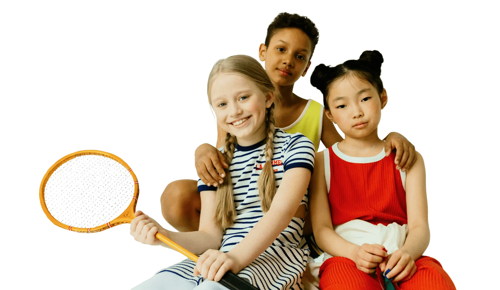 Photo of three happy children from diverse ethnic backgrounds, smiling together.