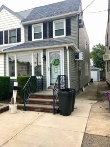 Picture of a house with new asphalt shingle roofing.