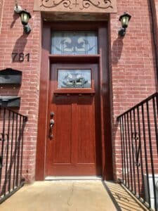 Entry doors having lamps