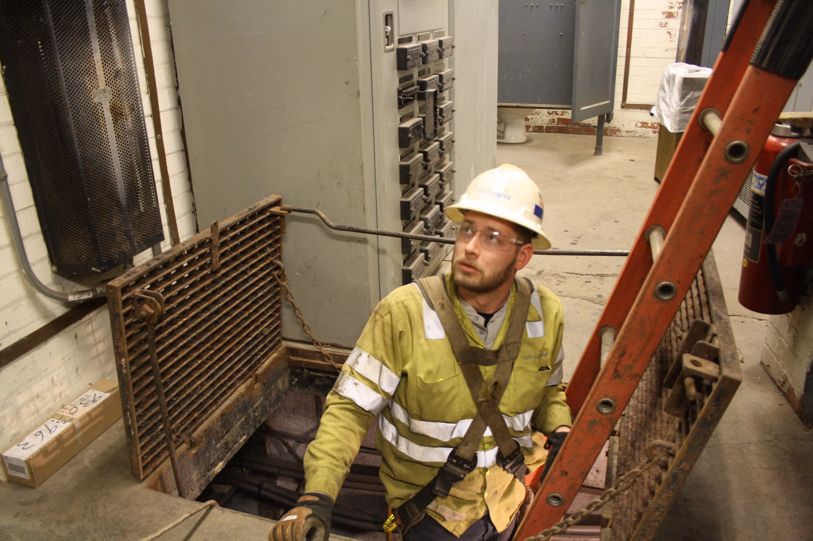 Electrical worker on ladder.