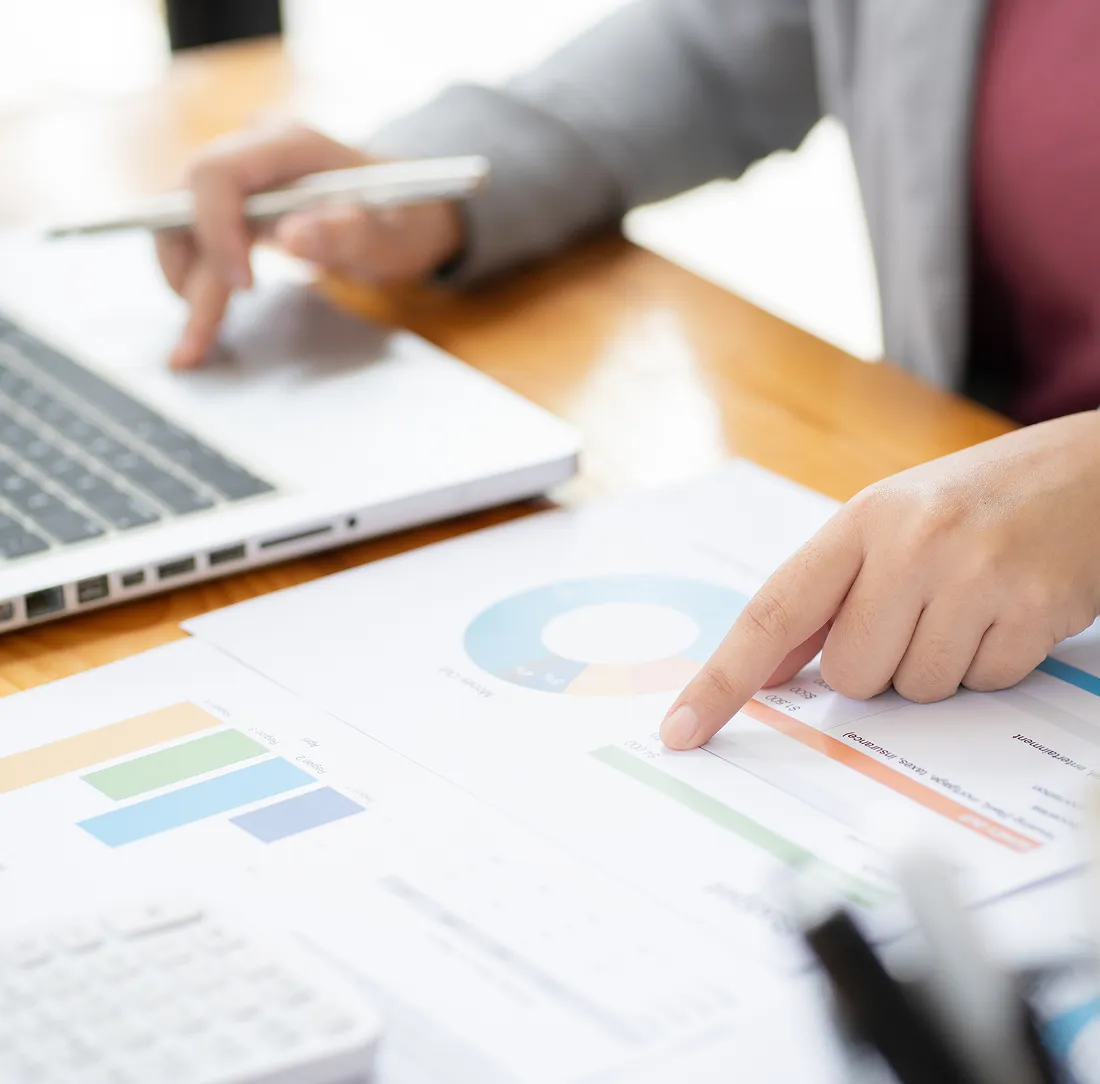 businesswoman reviewing investment charts