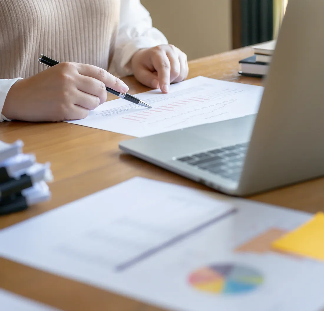 businesswoman analyzing financial charts