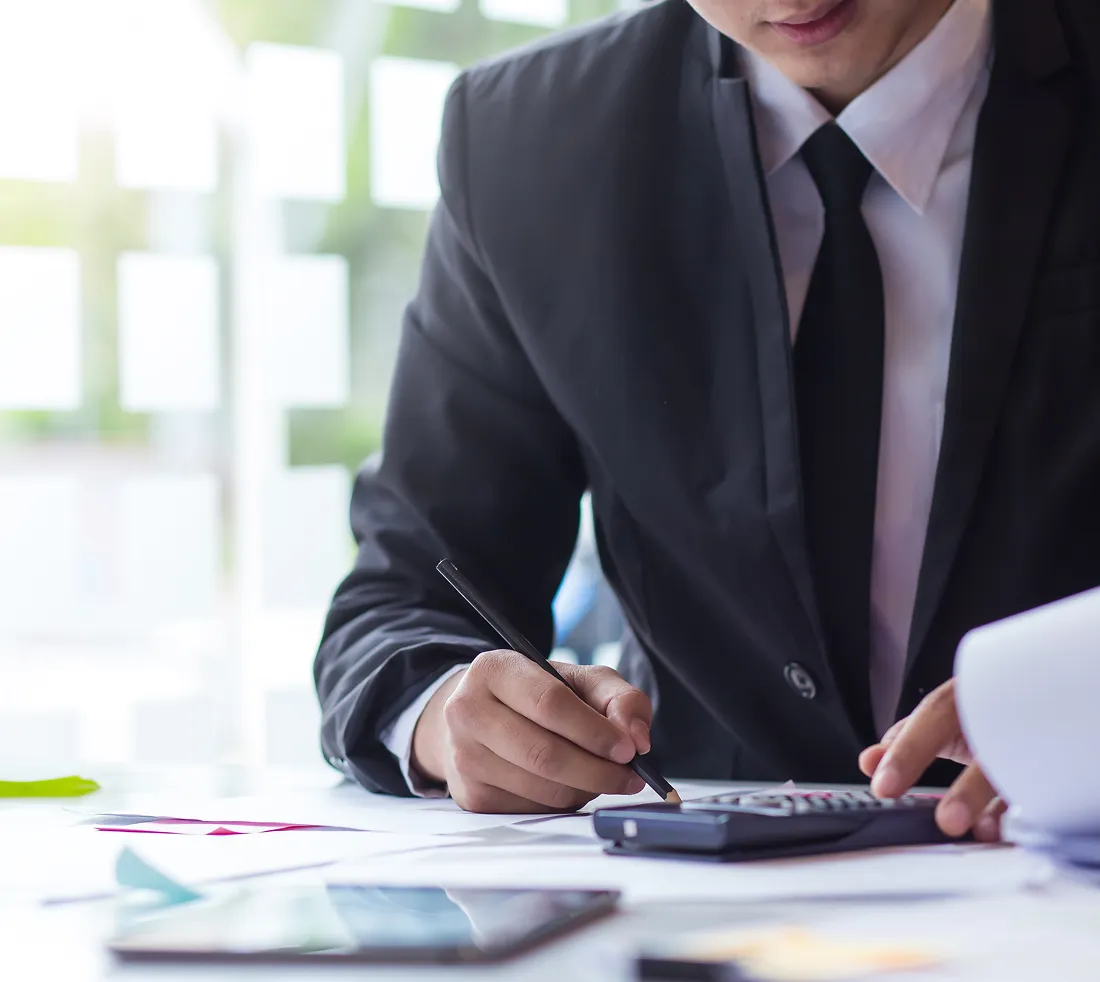 businessman reviewing documents at desk