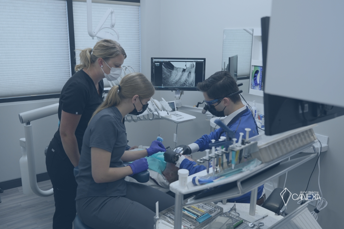 Image showing dentist and assistants working on a patient shot by Canexa Marketing