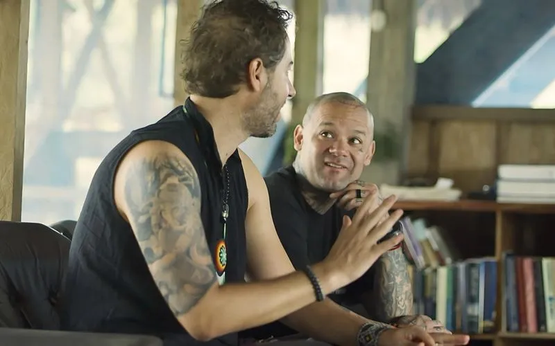 Two men engaged in deep conversation.
