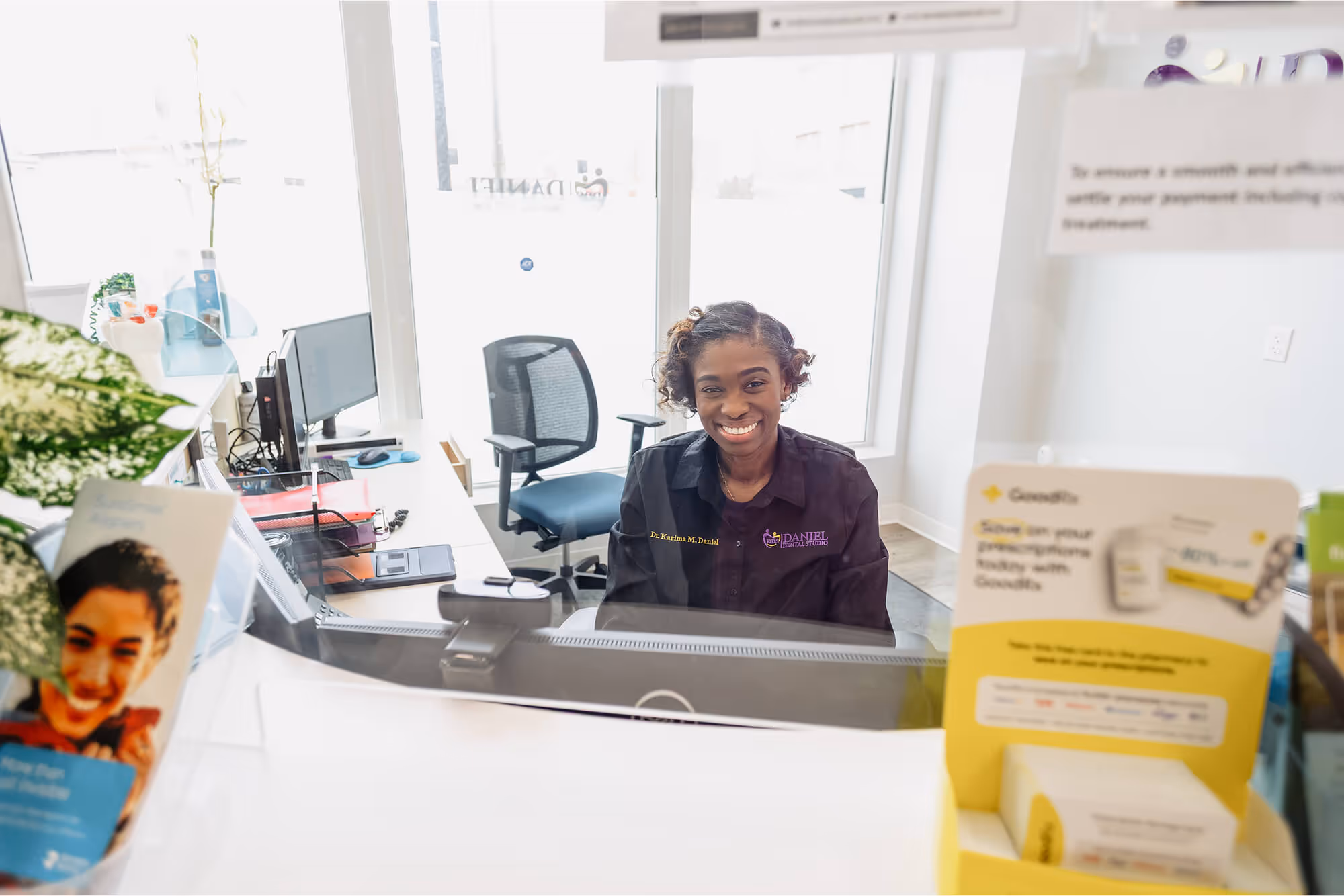 A woman sitting at a desk in an office.