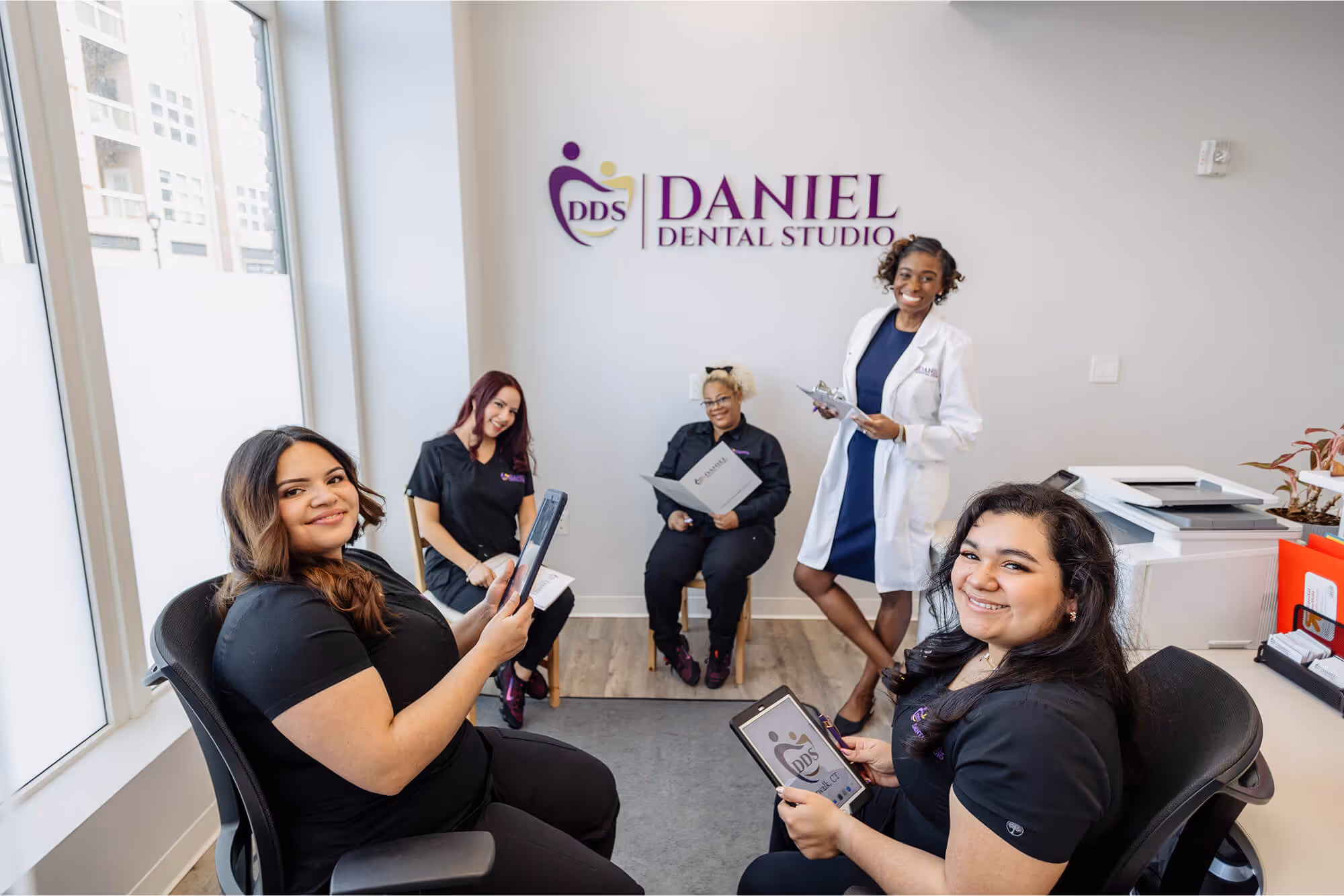 A group of women sitting in chairs in a room.