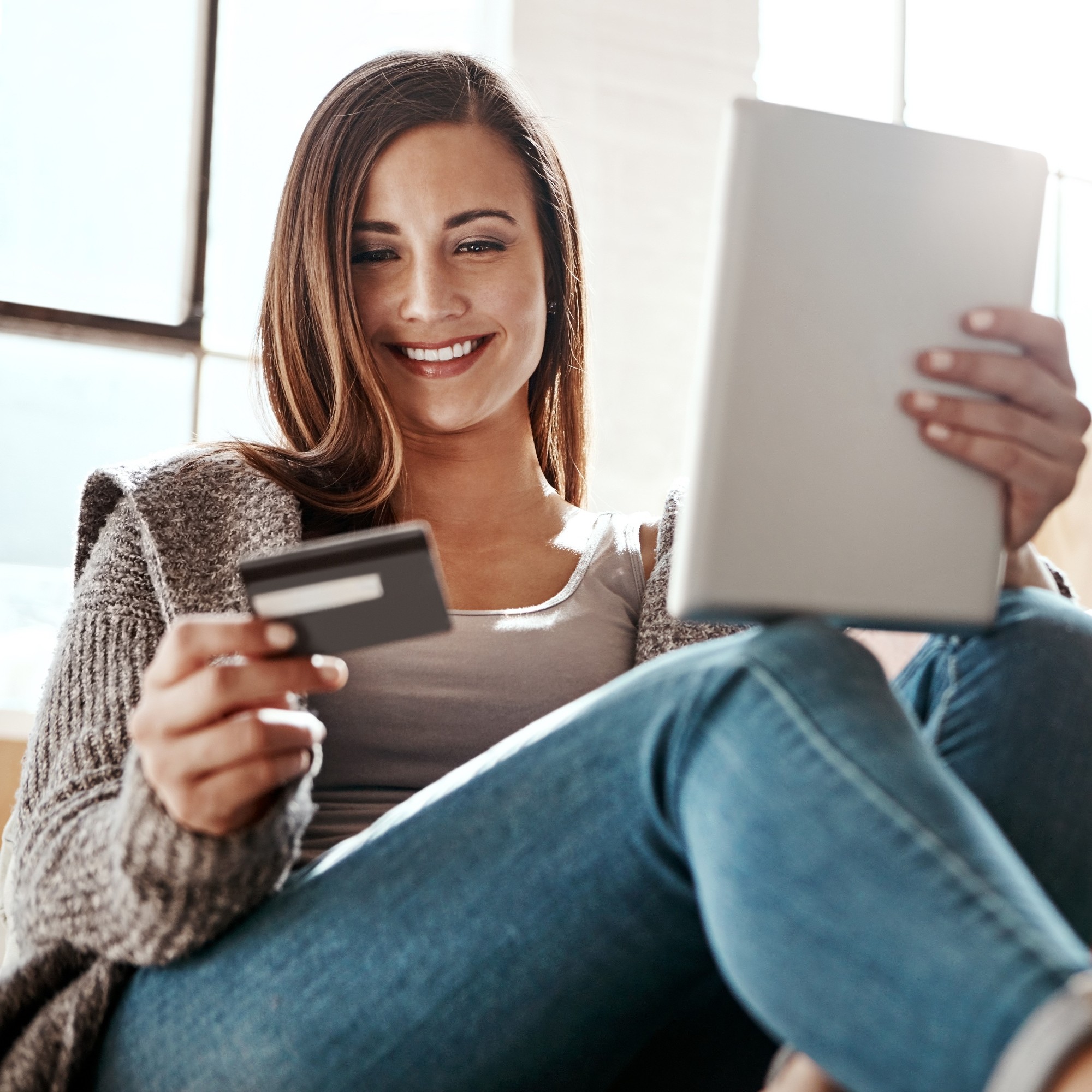 woman looking at credit card